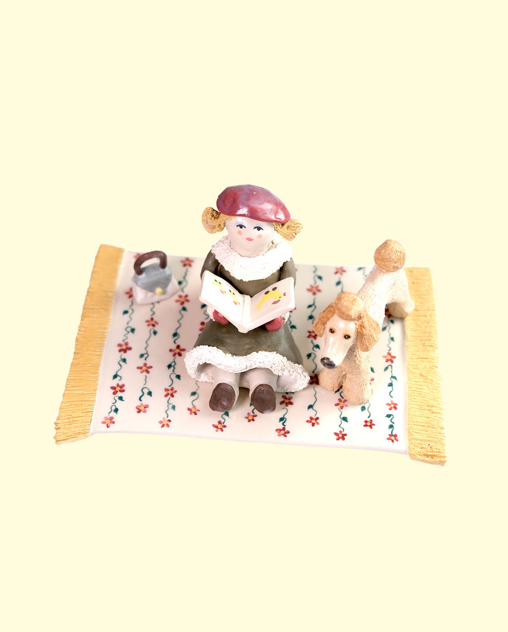 Woman reading to her Poodle