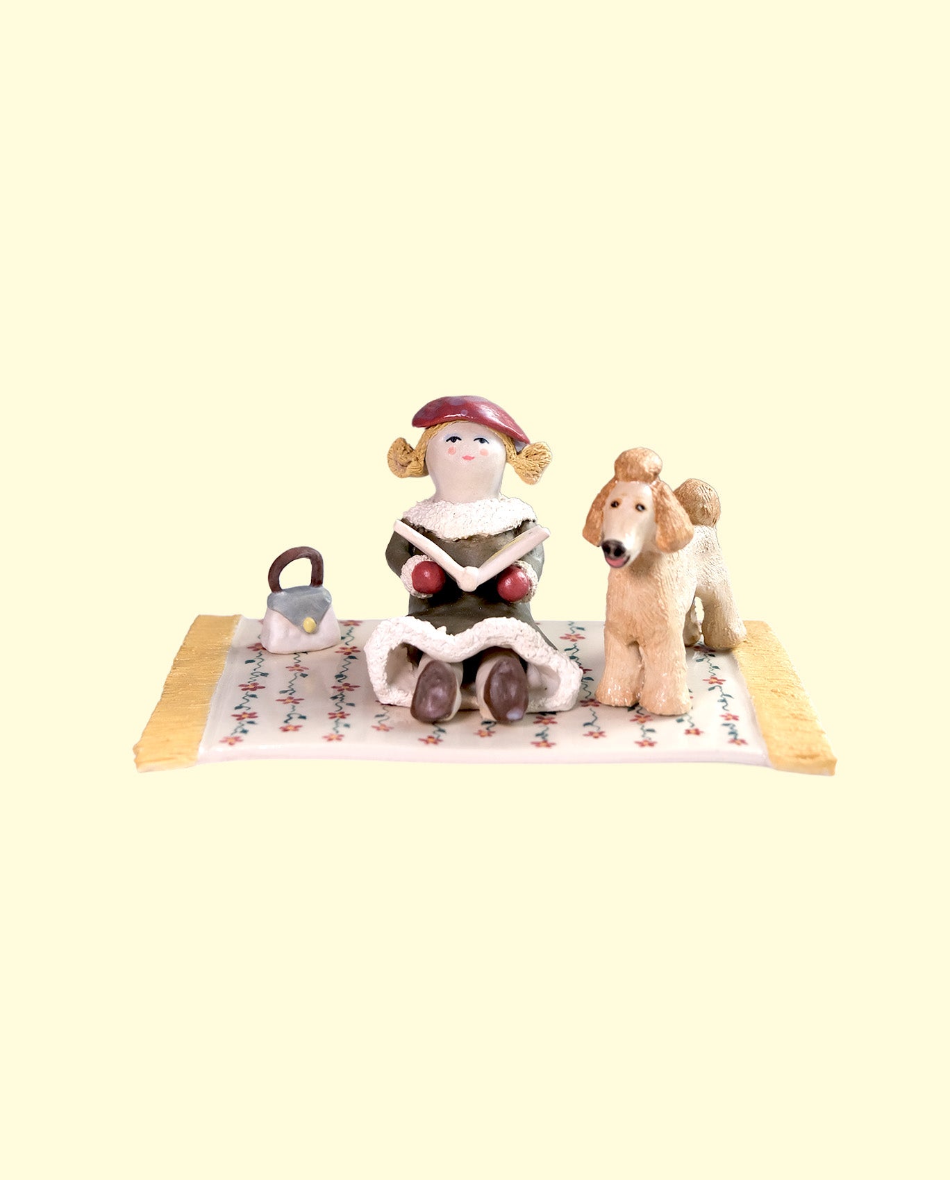 Woman reading to her Poodle